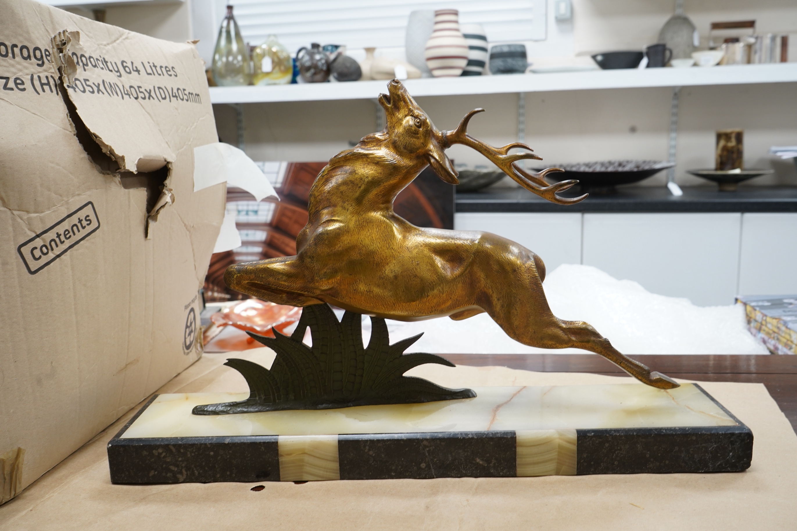 A French Bronze stag attributed to E Guy, on onyx base, 53cm wide x 33cm high